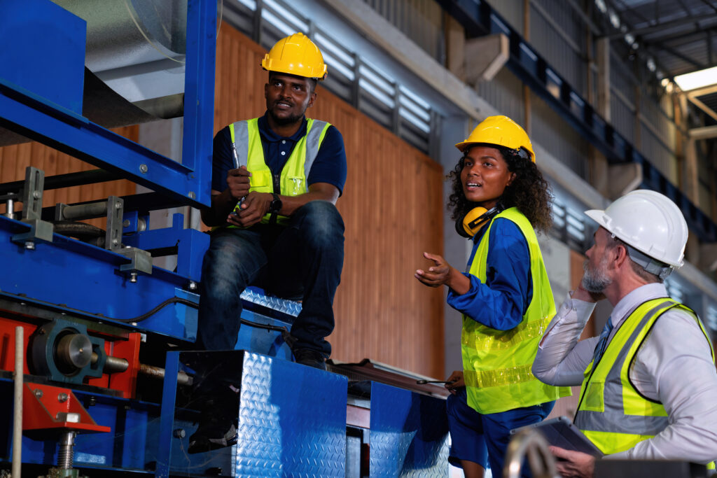 Warehouse team undertaking safety audit on machinery