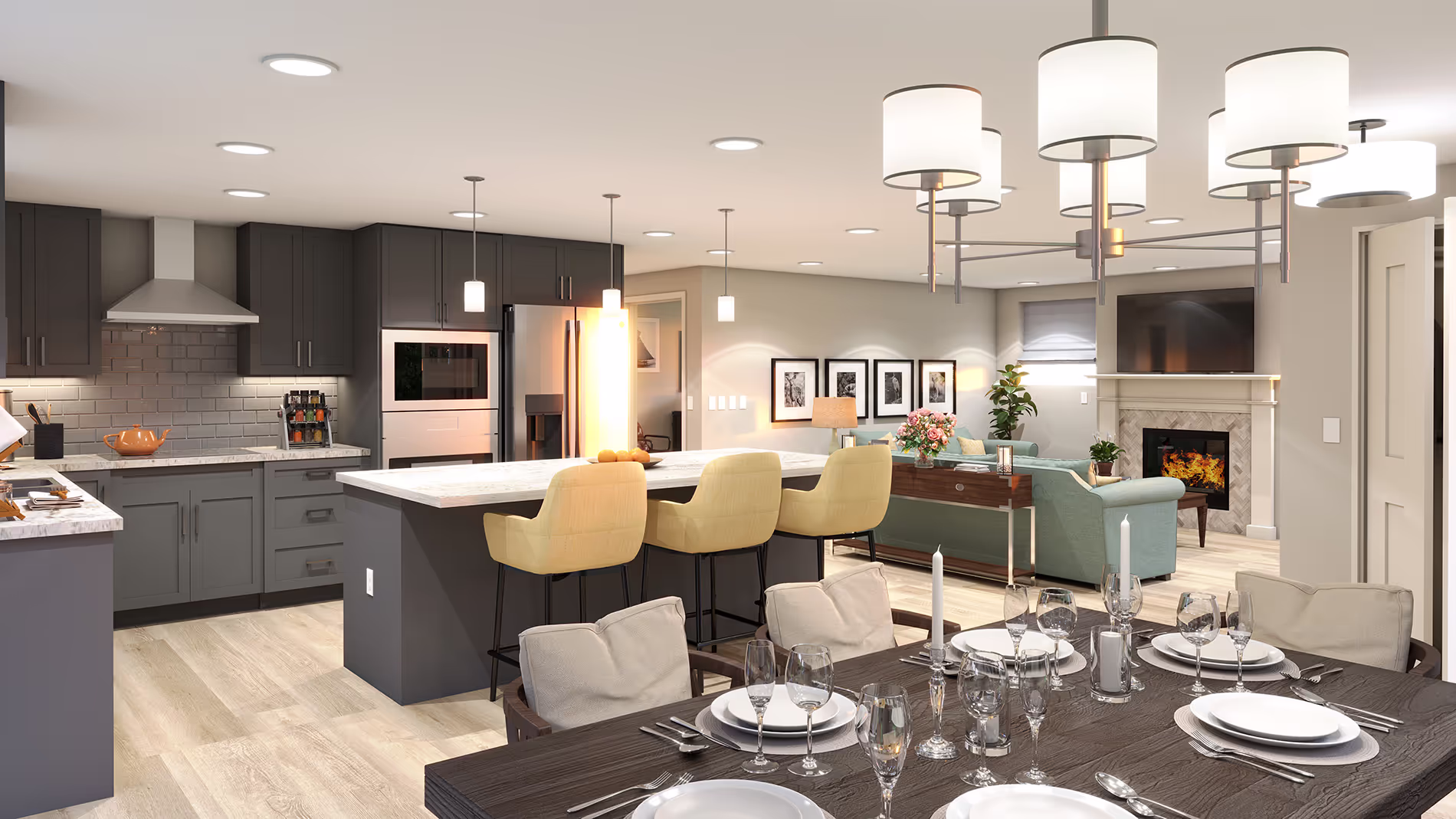 A modern kitchen and dining area with dark cabinets, a long table, and overhead lights.