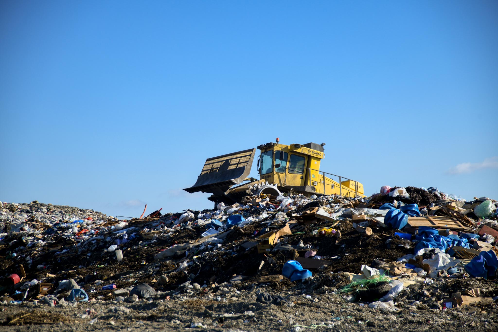 large bulldozer moving garbage around at the Augusta landfill