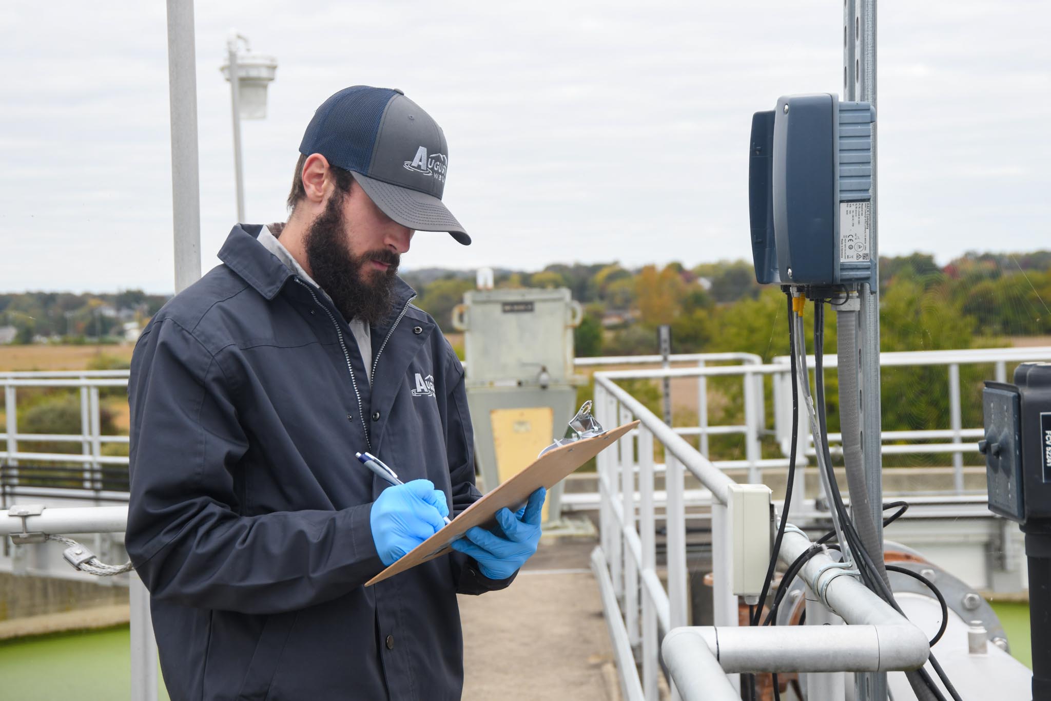 a water technician at the the water processing plant going over results.