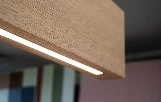 Innovative ceiling design using Balken acoustic baffles for sound absorption.