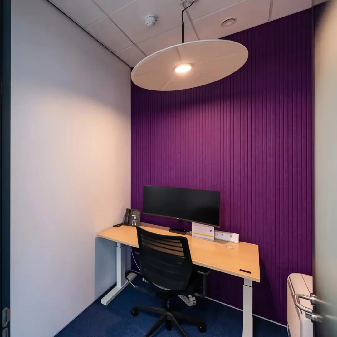Vertigo acoustic wall panel with vertical V-cut lines by Impact Acoustic installed on office wall