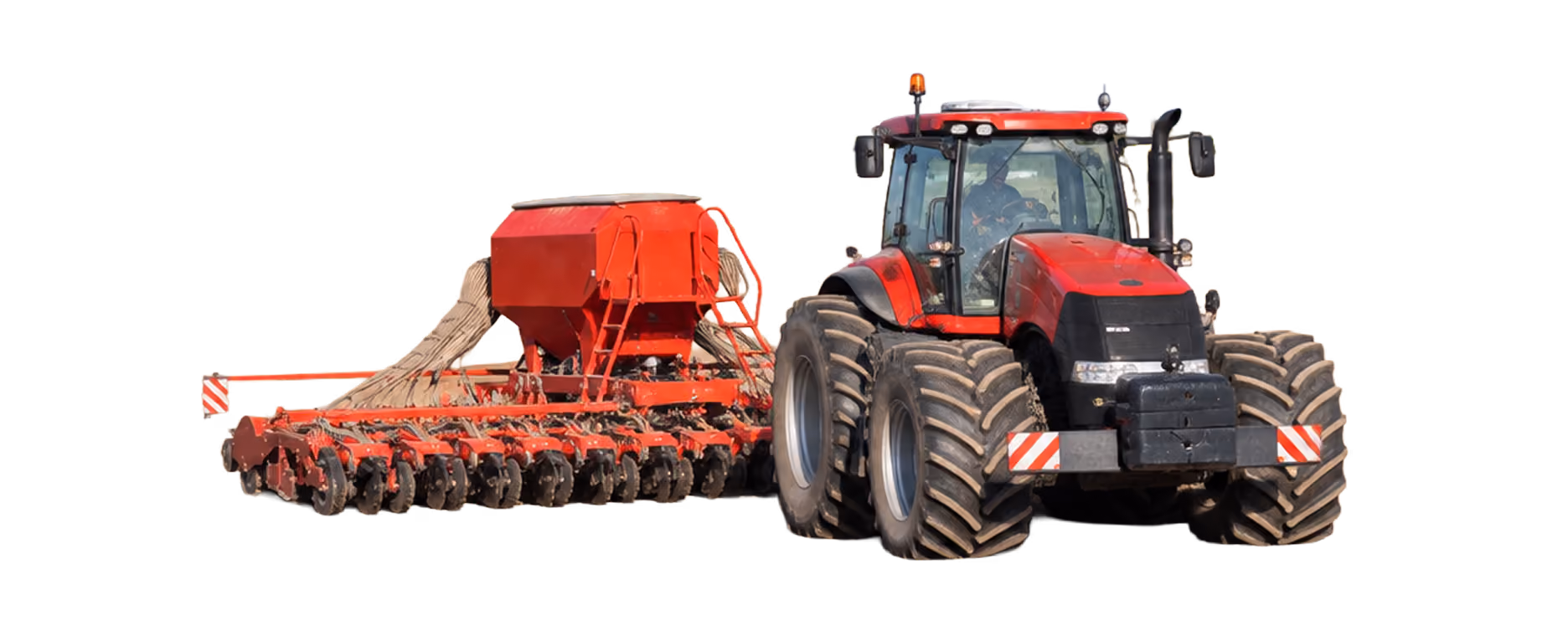 Tractor pulling a seeder for agricultural work