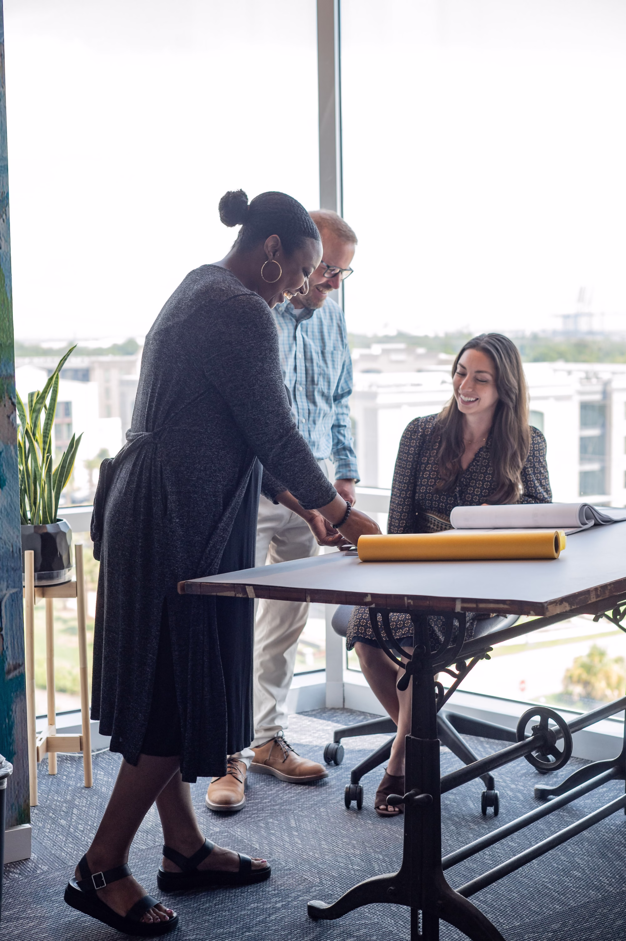two women, discussing design options, a collaborative team reviewing color swatches 