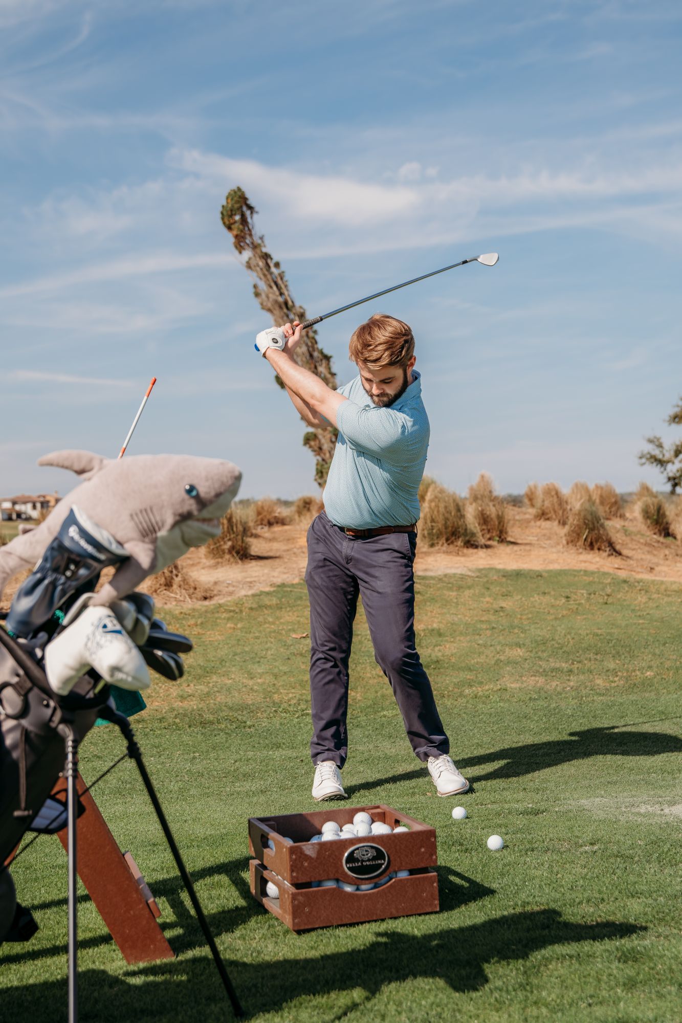 Spencer Schar playing golf on the golf course.