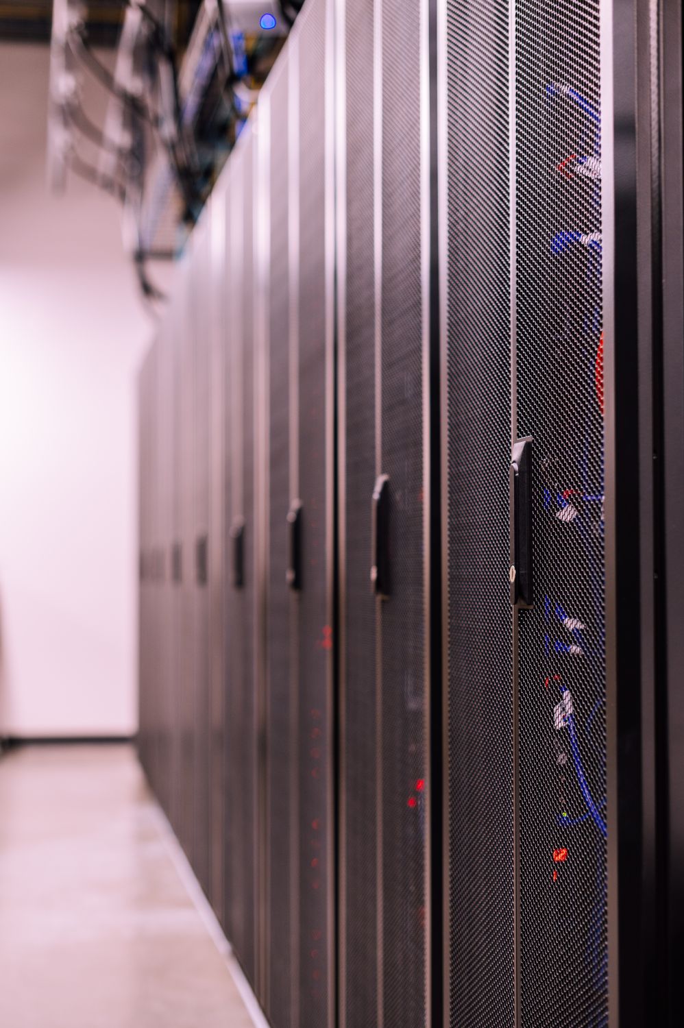 Fiber optic cables in a modern data center server room
