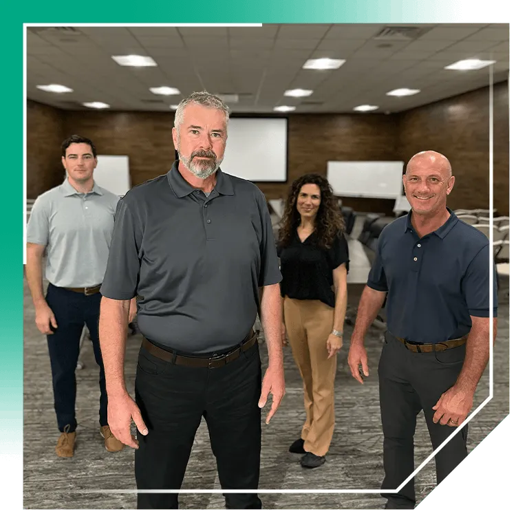 Four-person foundation repair team in a conference room, company leaders for foundation and basement waterproofing.