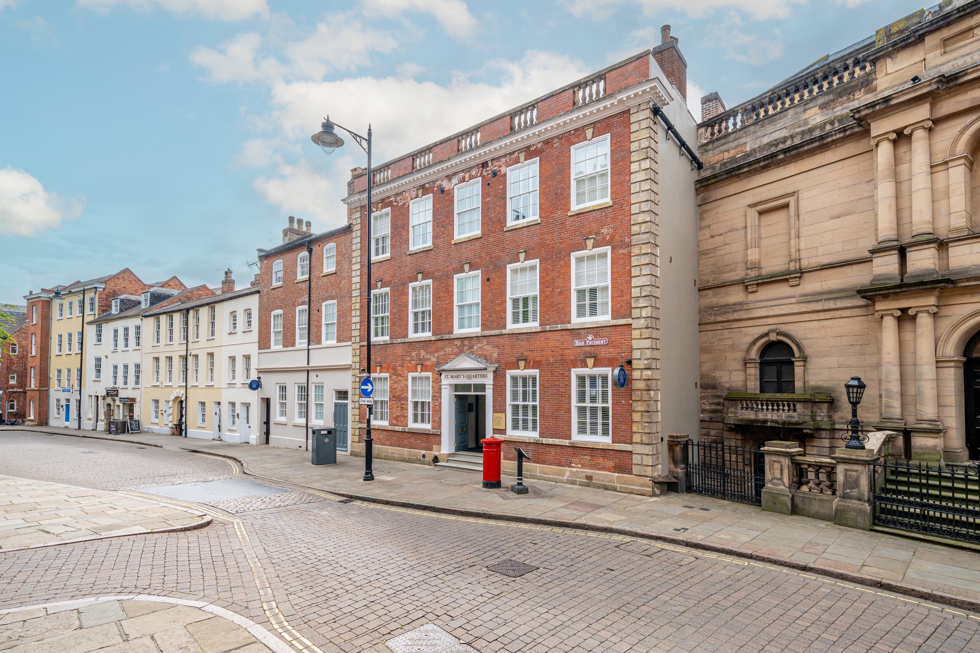 Fron tof St. Mary's Quarters with double door way and windows either die