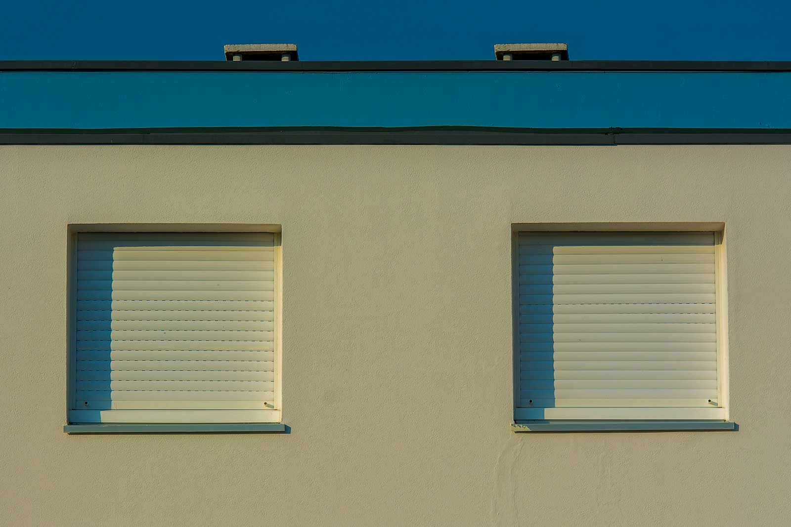 Close-up of a modular building wall with shuttered windows