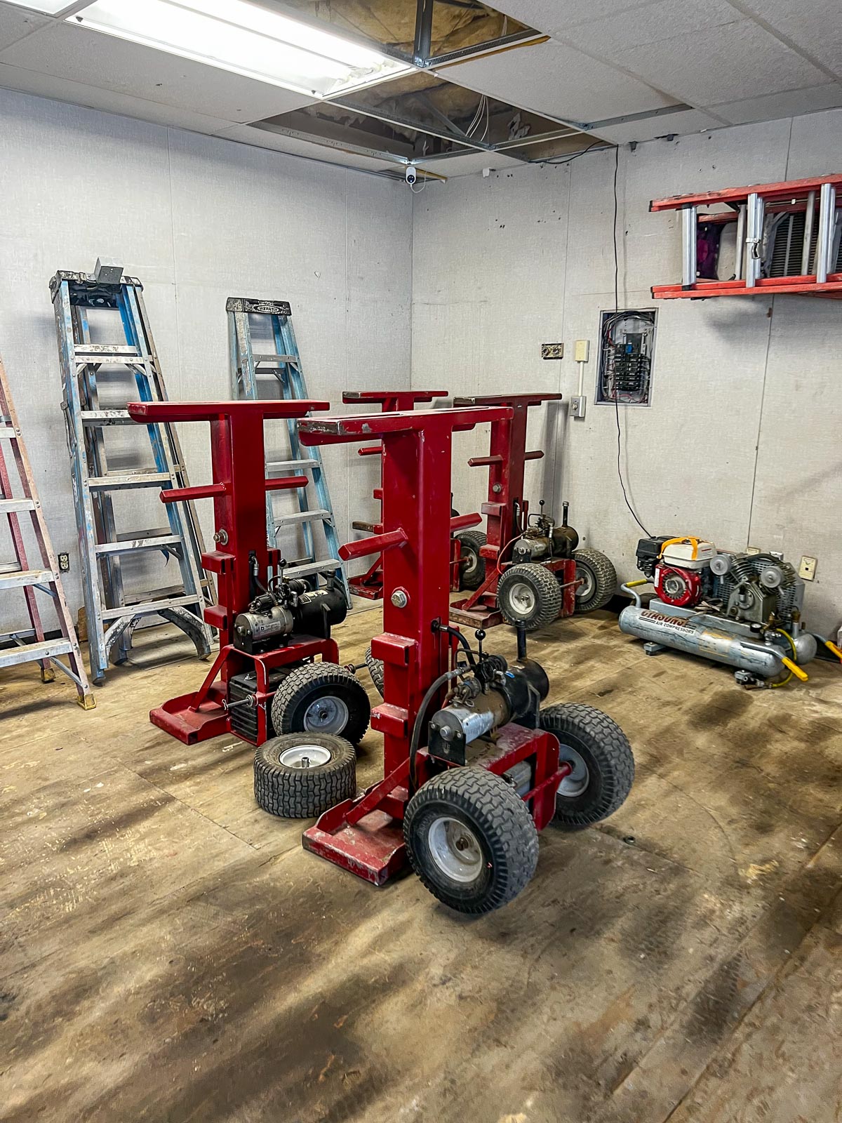Pro-Fab hydraulic jacks for moving modular buildings, staged in the shop