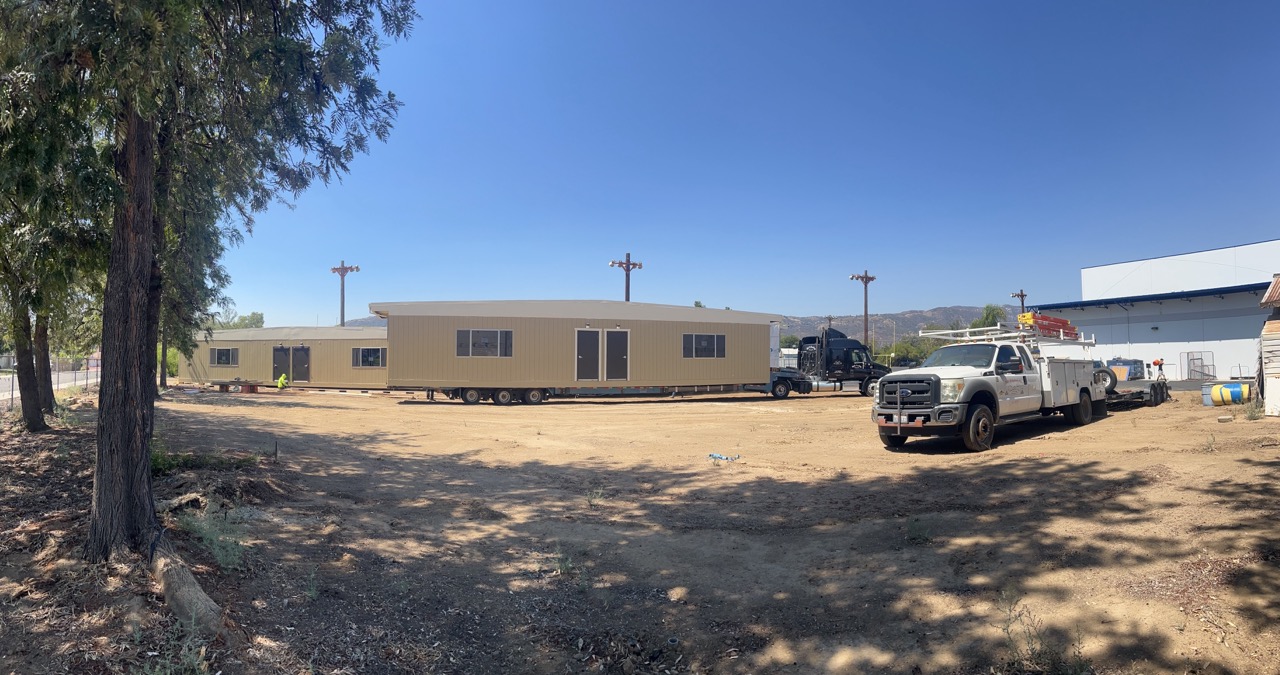 Modular classroom buildings set in place on a graded site