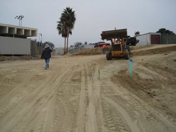 Loader grading the site pad at Dana Point High School