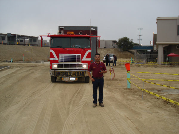 Crew member beside the delivery truck at the school site