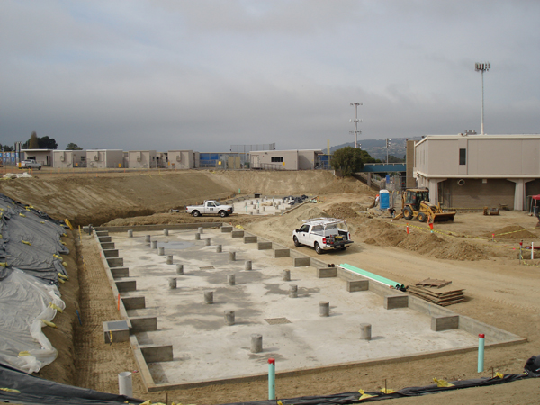 Concrete pier foundations laid out for the modular restroom building