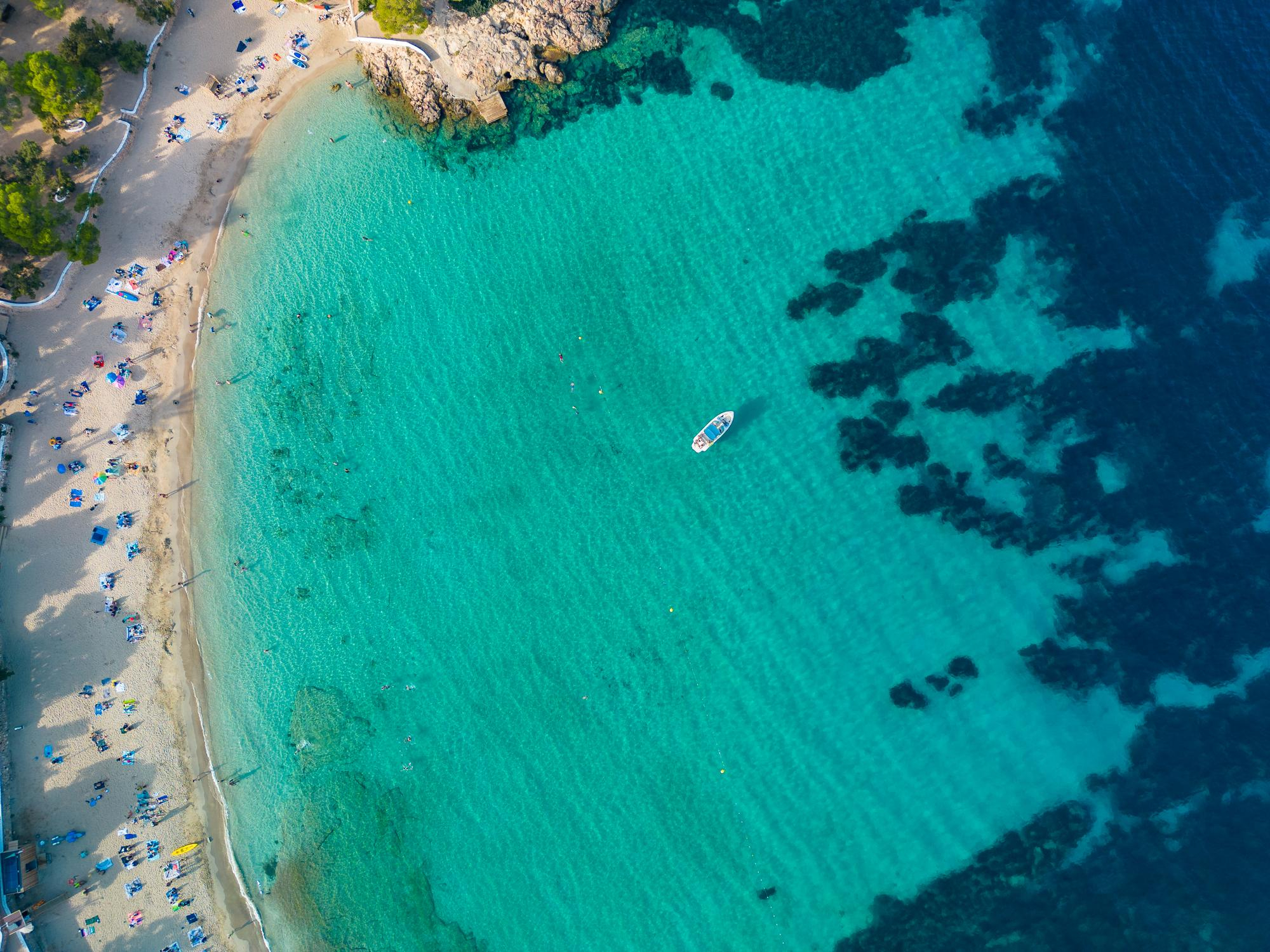 Cala bassa in Ibiza with a yatch