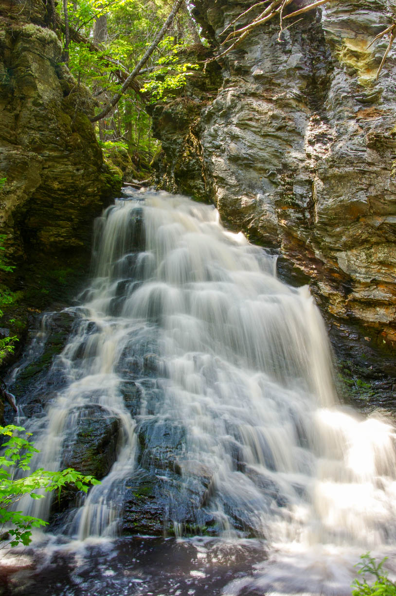 A little waterfall that sits along the east coast of Canada in New Brunswick. This place is a local's hidden gem because it is not wildly known by travelers, yet there are websites pertaining to these falls. The falls shown in this image are one of the many at Sheephouse Falls in Miramichi, New Brunswick, Canada.