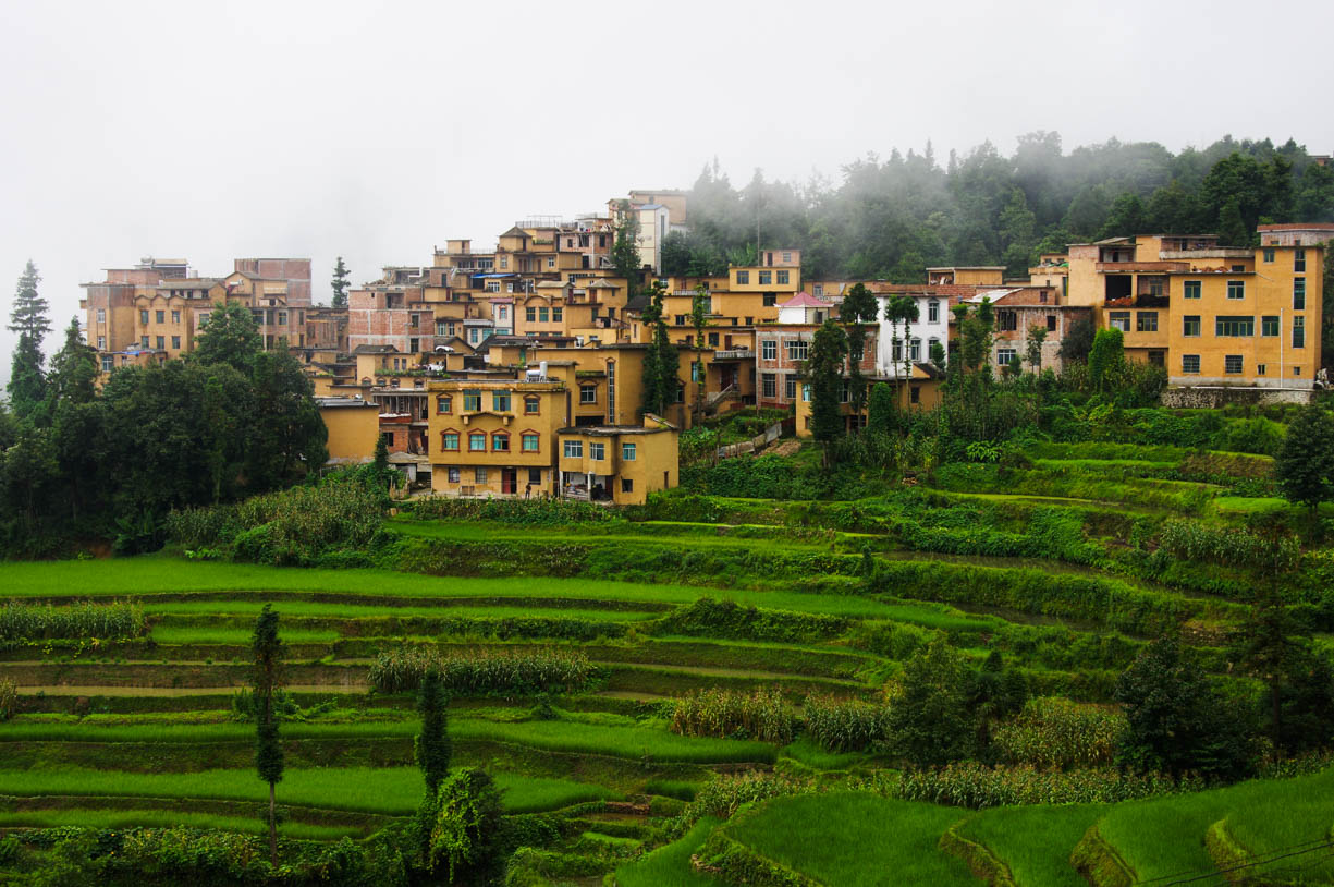 Rice terraces and its yellow architecture on the border of Vietnam and China photographed on a cloudy day.