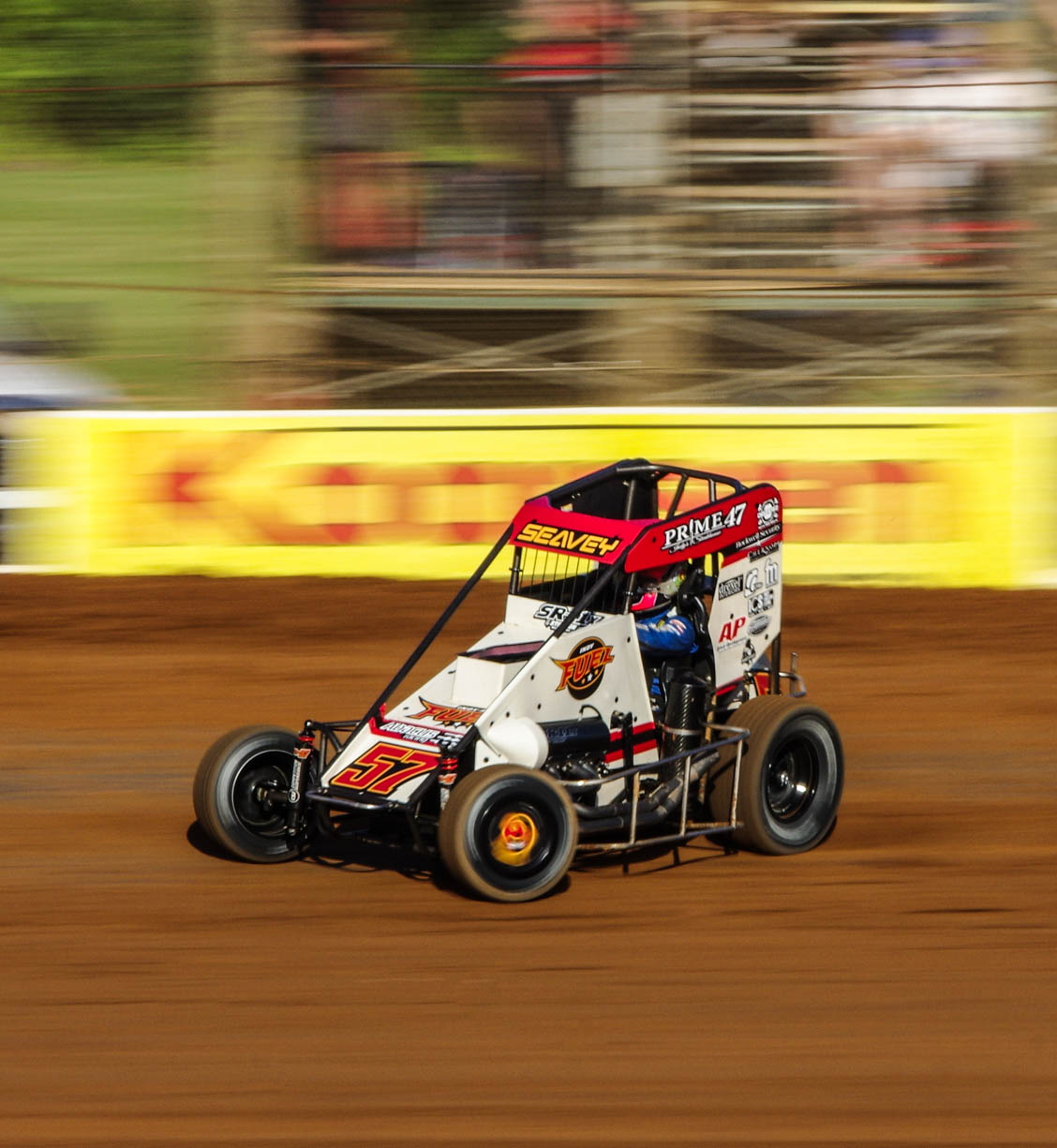 A white and red 410 Sprint car racing sideways through a corner at the Bloomington Speedway on June 14, 2024 in Bloomington, Indiana