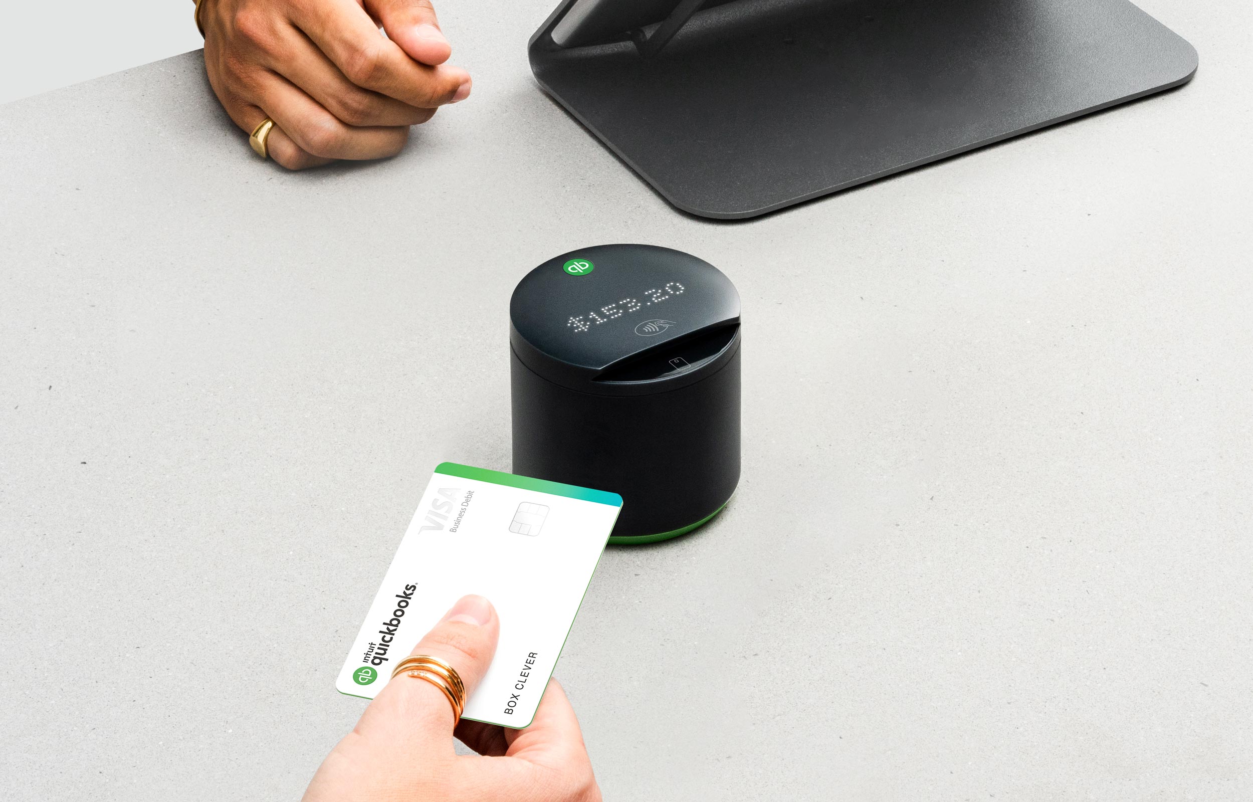 Quickbooks Debit Card tapping on the card reader.