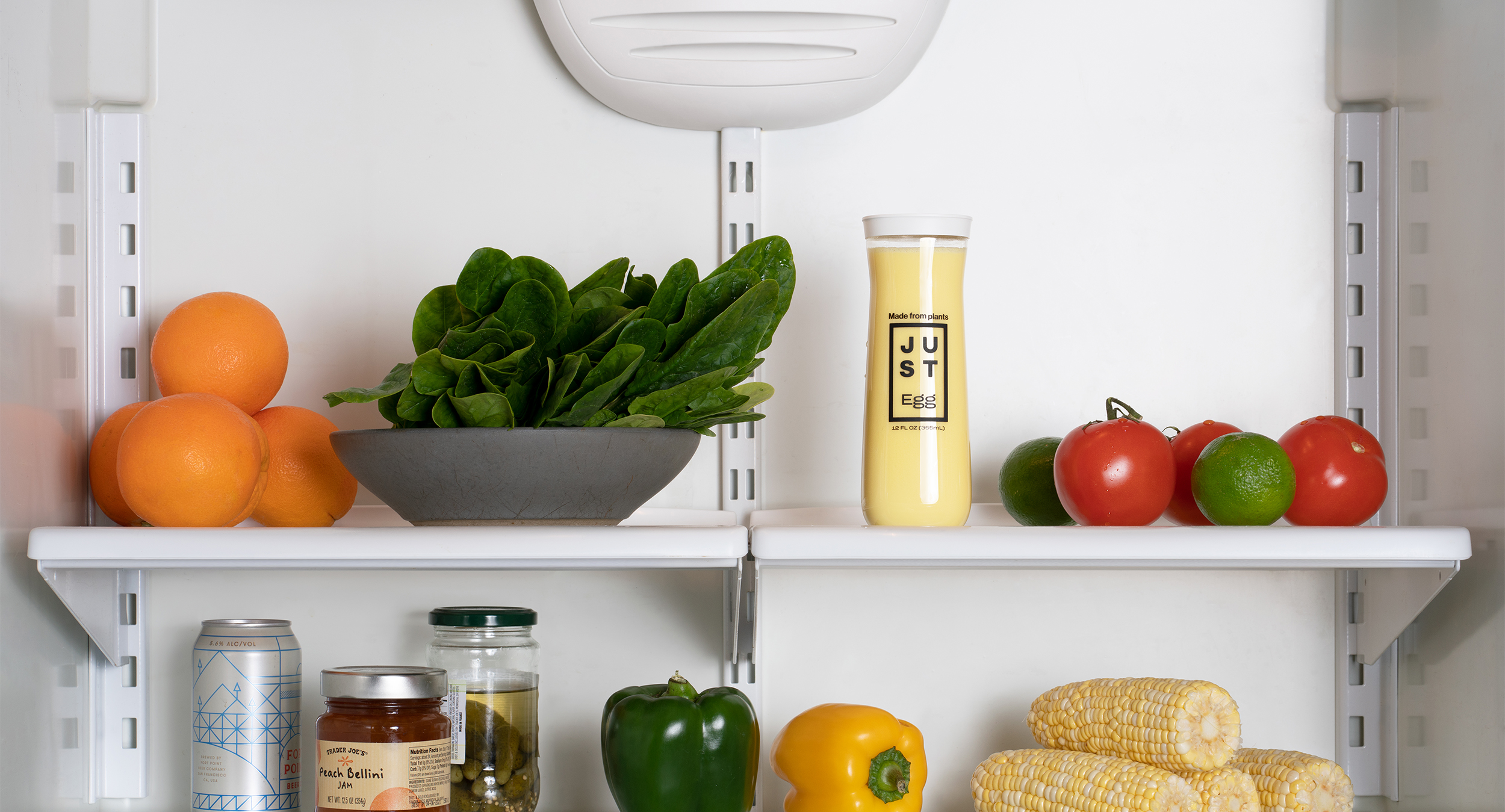 Just Egg glass bottle design in fridge.