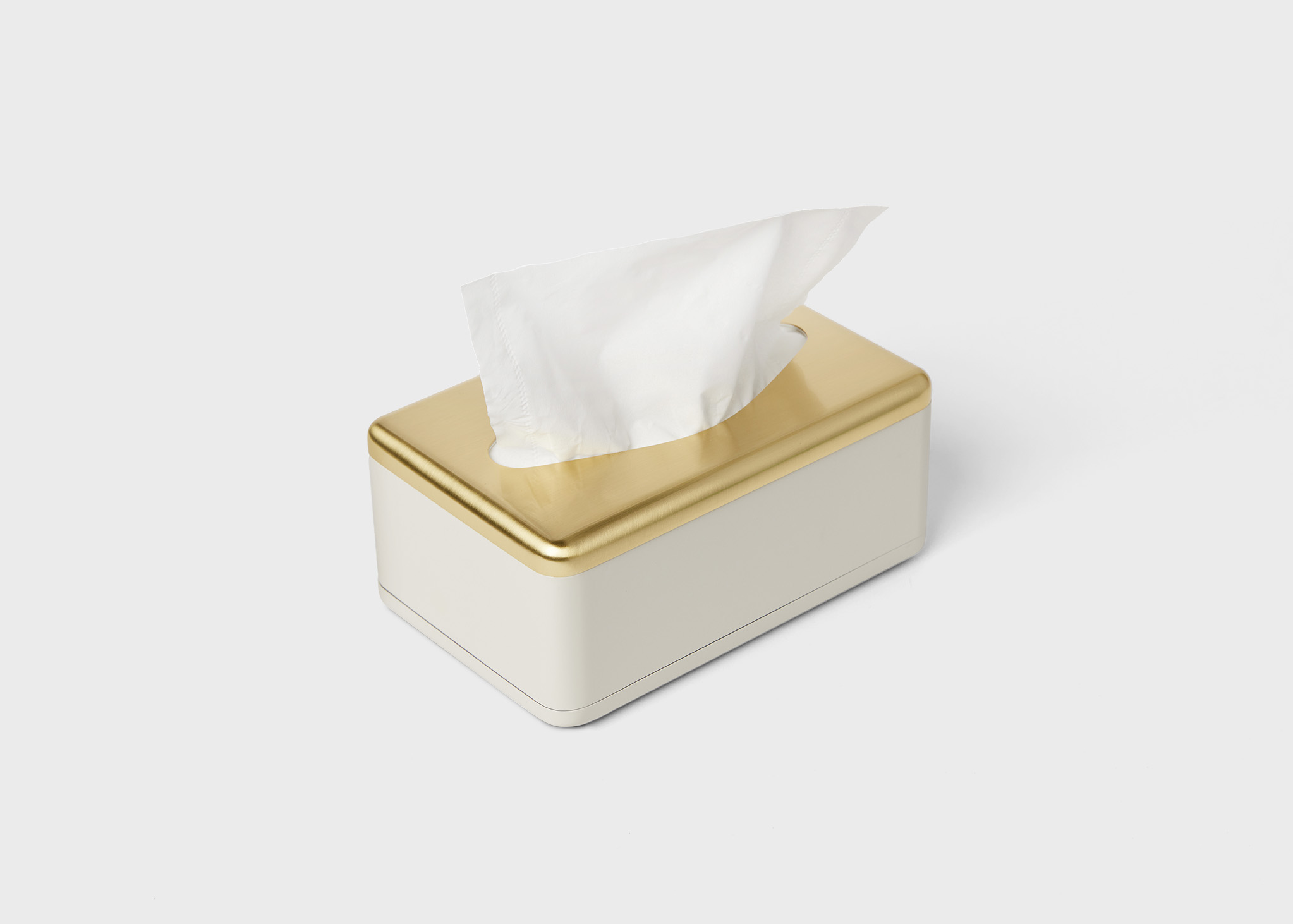 Fox Fold Facial Tissue Dispenser in cream and gold color.