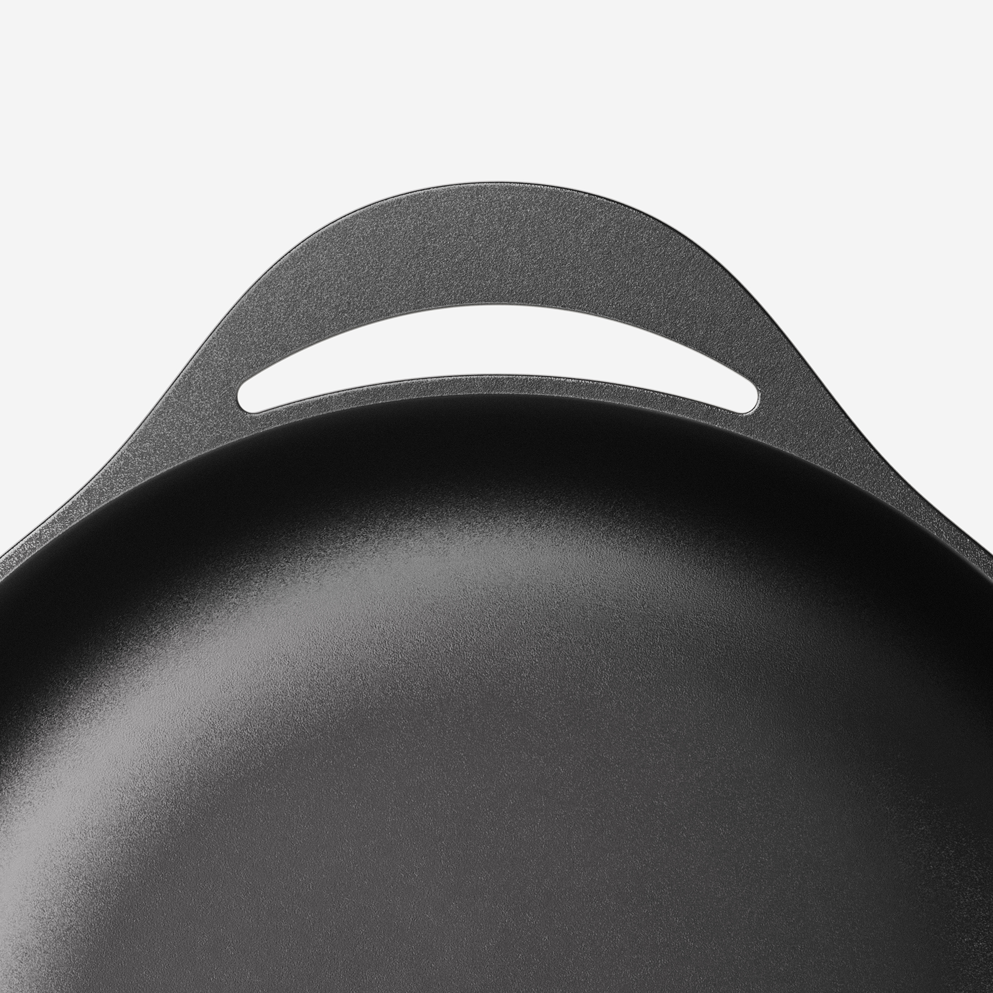 Side handle detail of Caraway Cast Iron Dutch Oven.