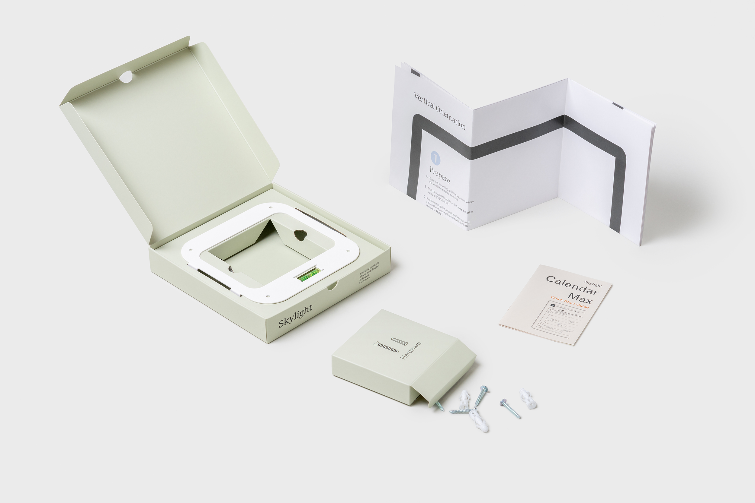 Skylight Cal Max packaging inner accessories box opens to reveal mounting plate and guide.