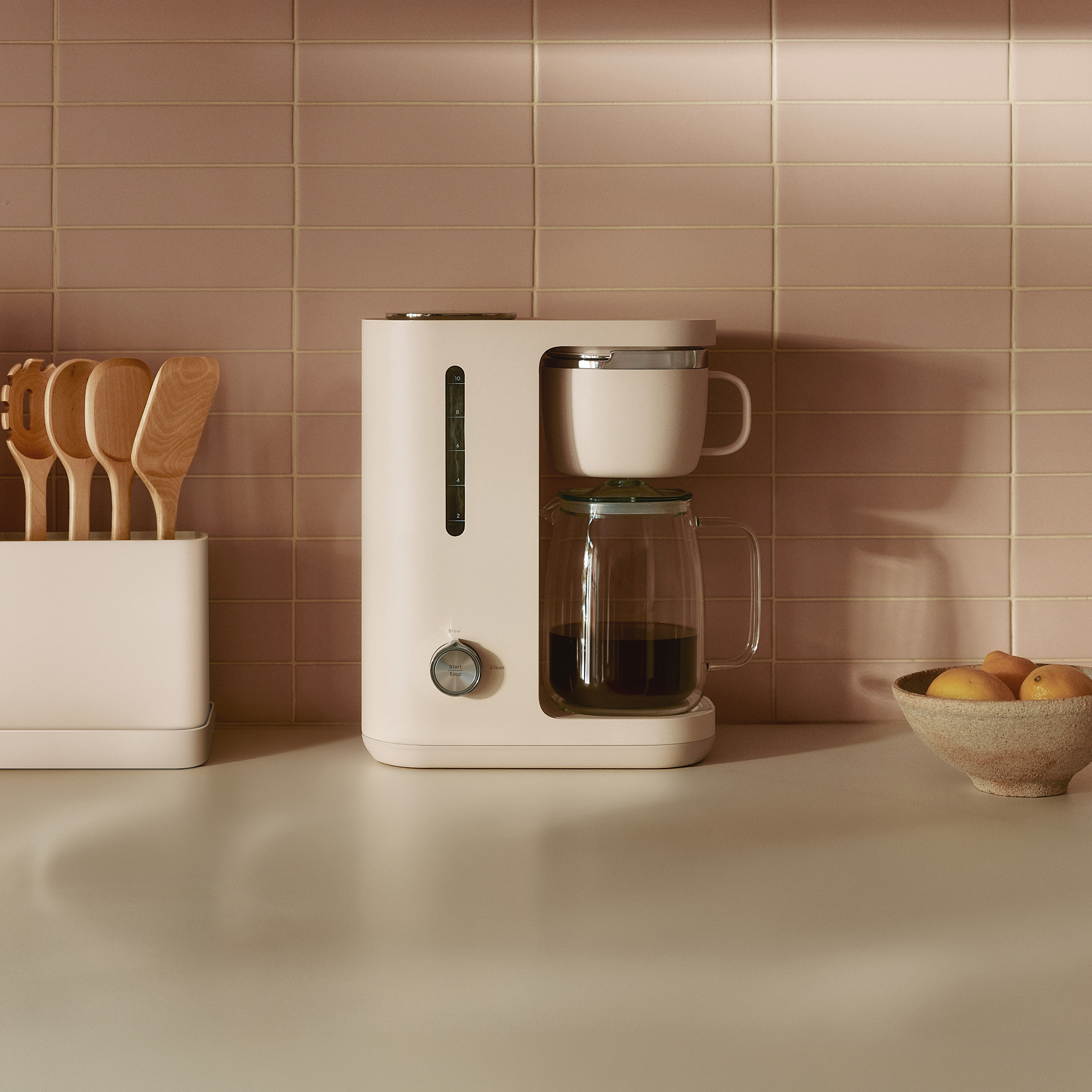 Caraway Coffee Maker on kitchen counter.