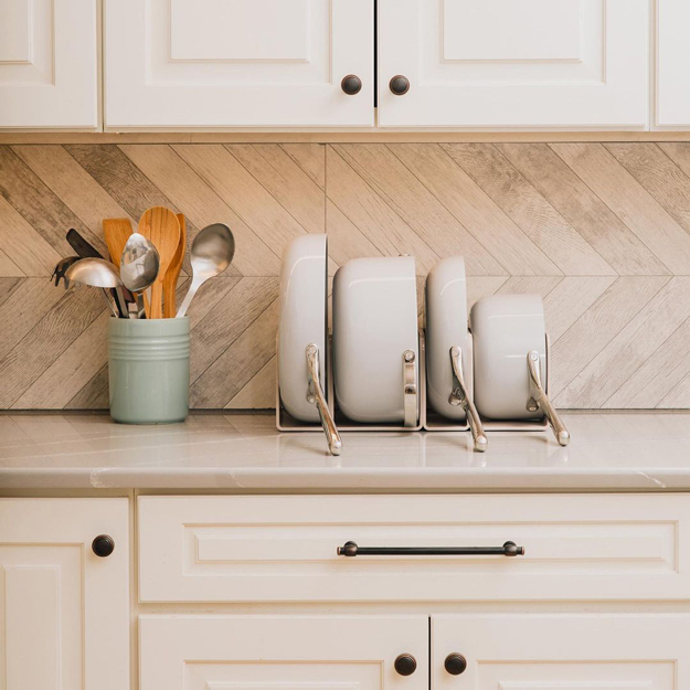 Caraway Cookware stored on a kitchen counter