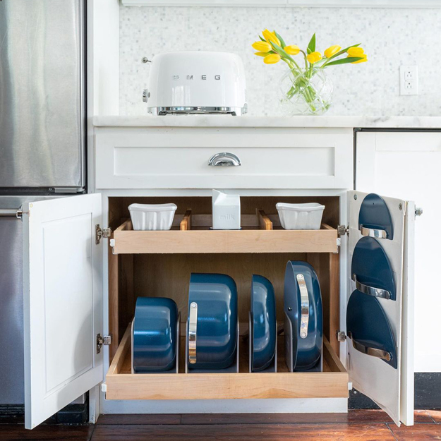 Caraway Cookware stored in a cabinet