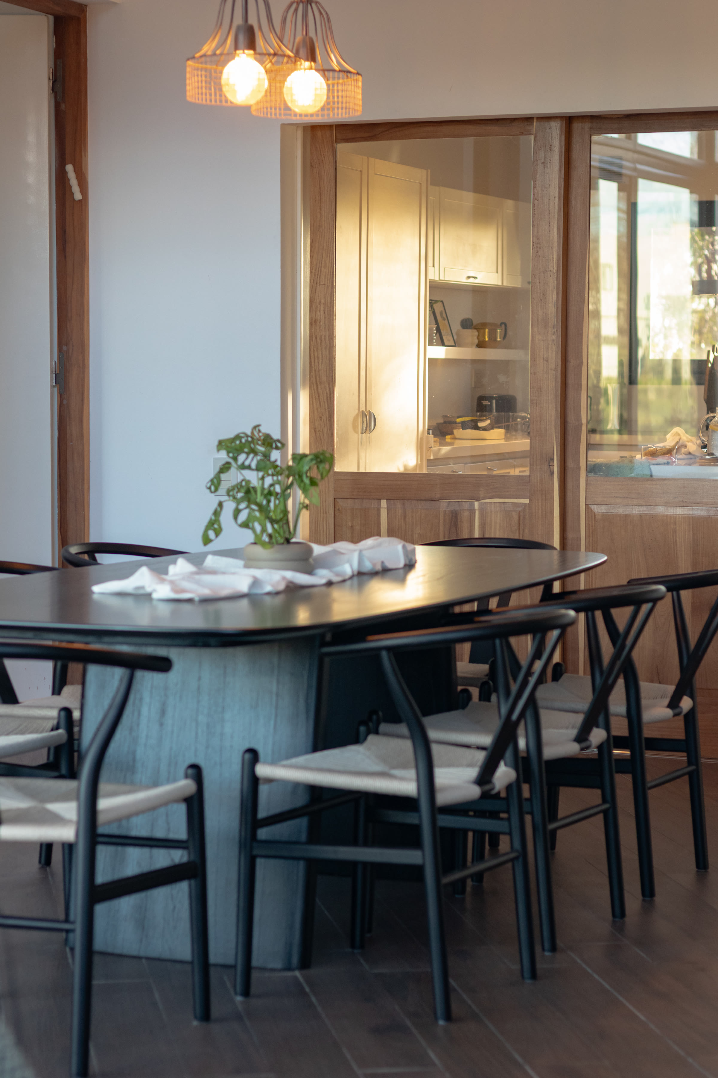 Generous dark wood dining table set for hosting
