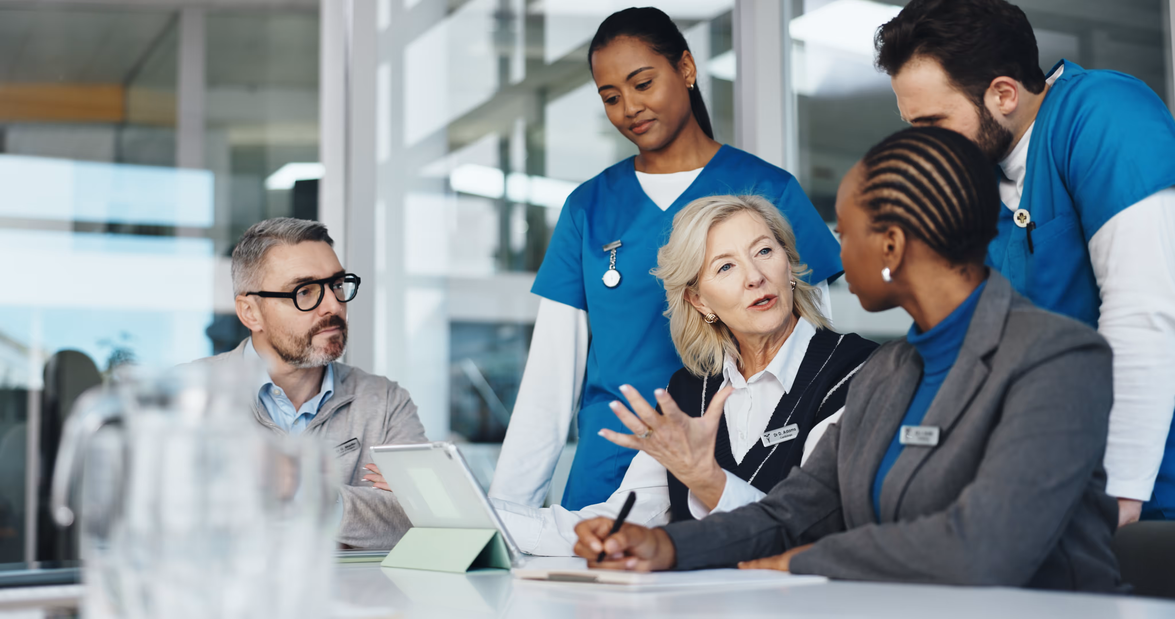 Hospital executive reviewing patient logistics ROI metrics on digital dashboard