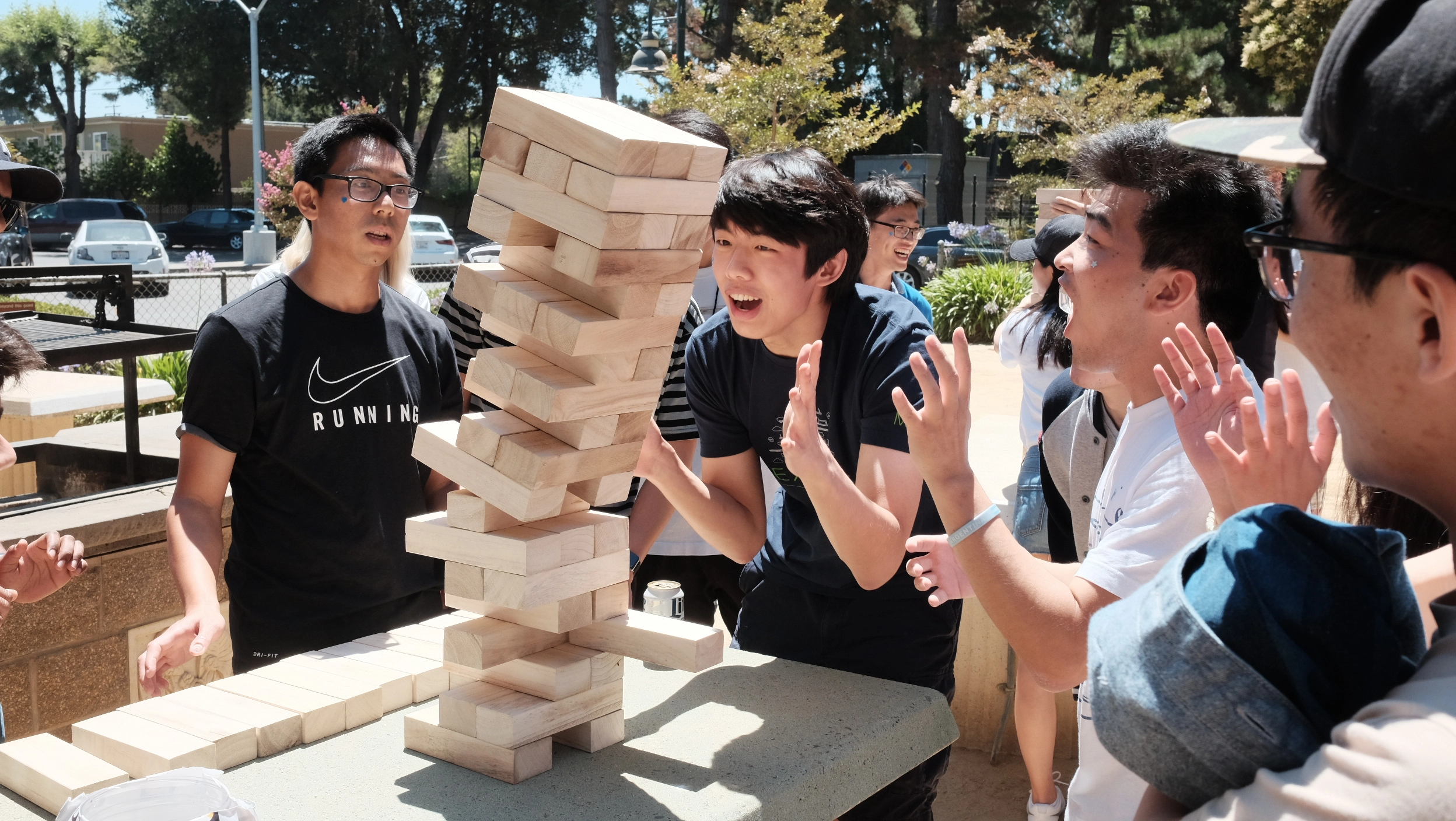 A group of people playing game of dominos