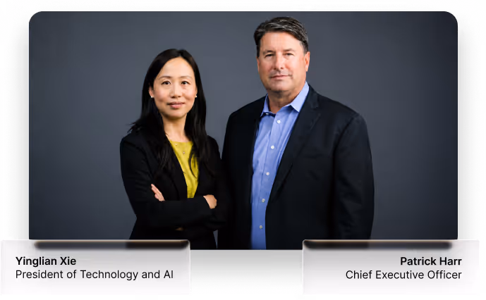Portrait of Yinglian Xie and Patrick Harr, executives posing against a dark gray background.