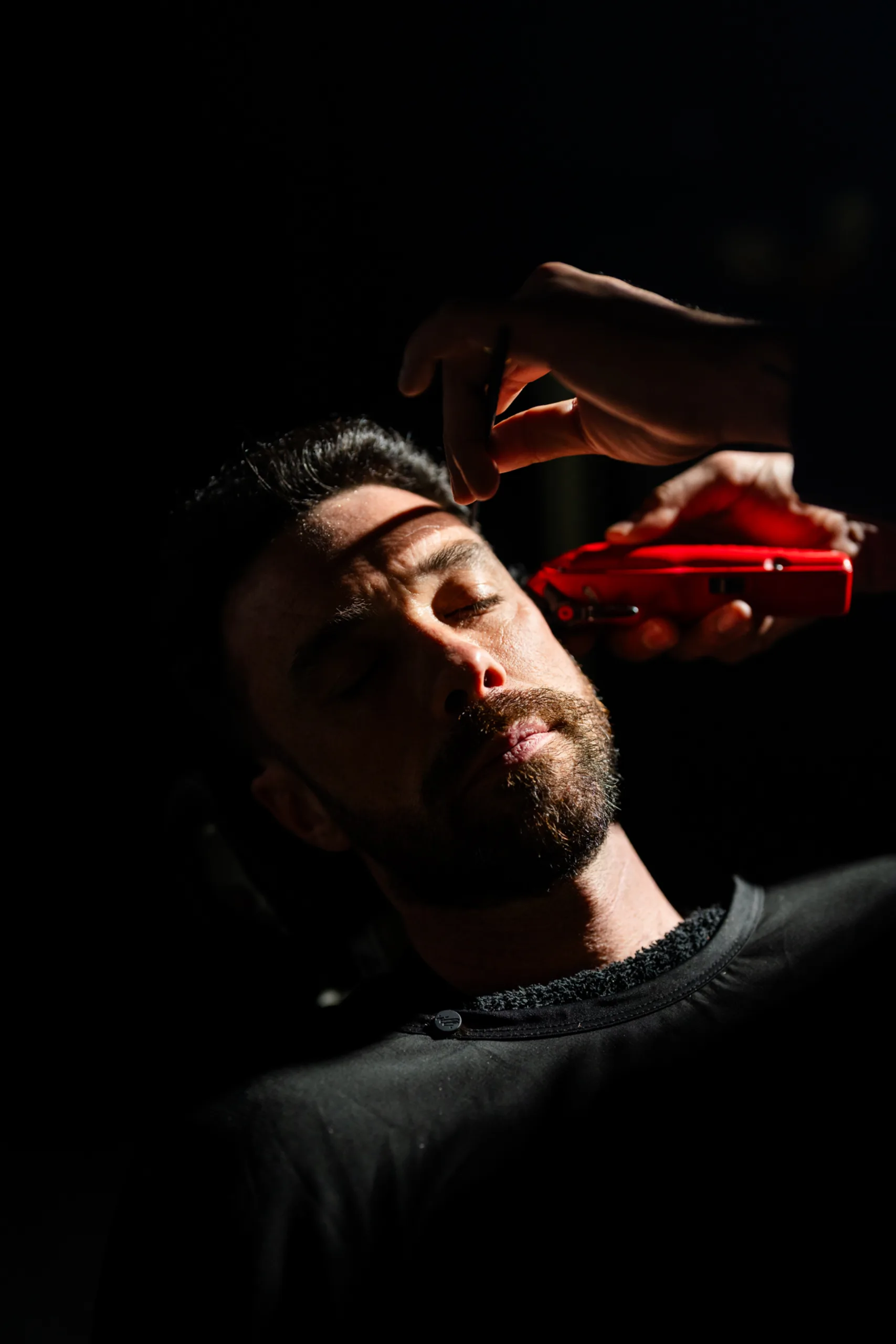 A haircut in progress, warm light