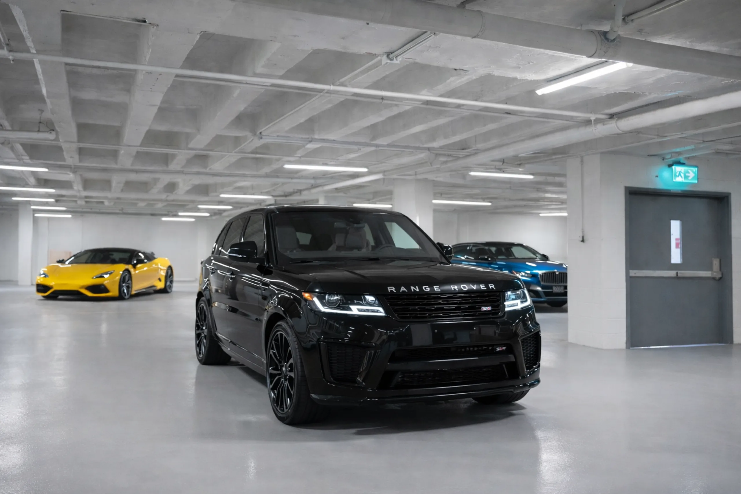 Luxury vehicles in the indoor parking garage at Gallantier