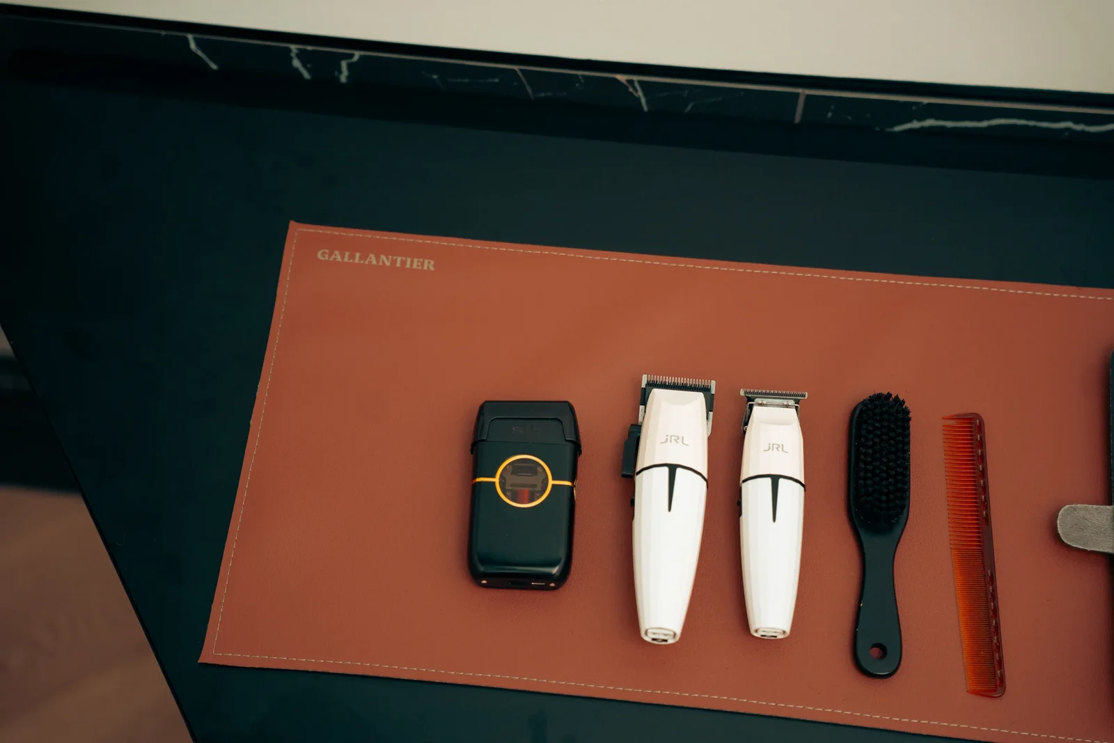 Gallantier grooming tools on the leather mat