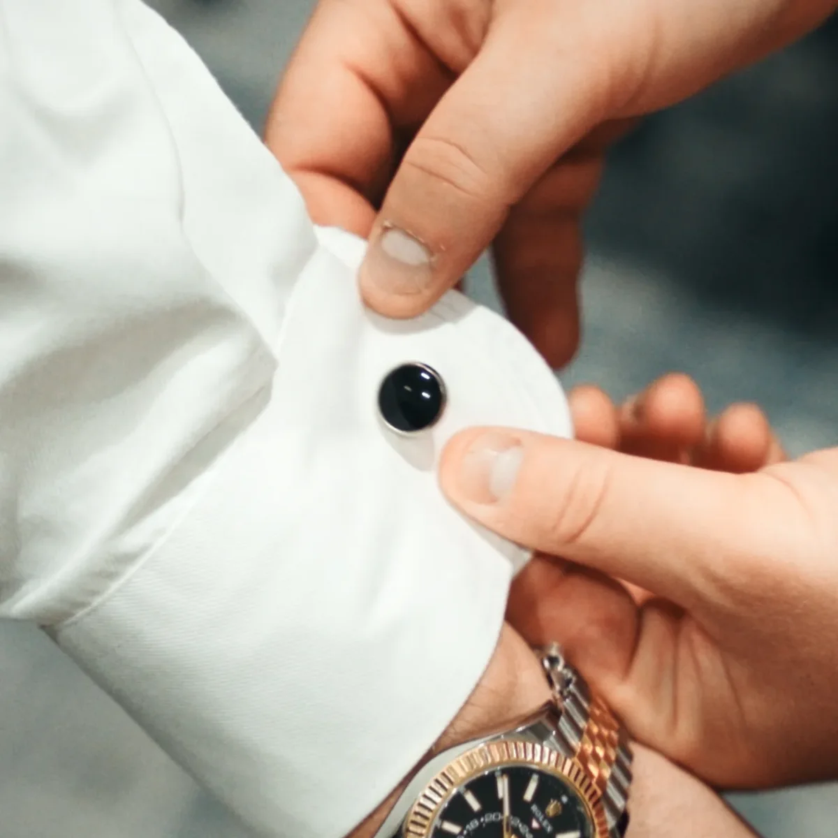 Cufflink detail on a crisp white shirt