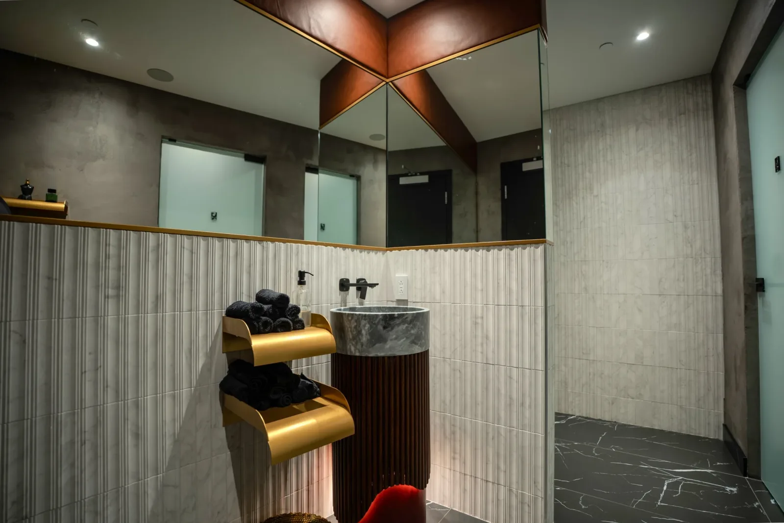 The washroom, marble and brass