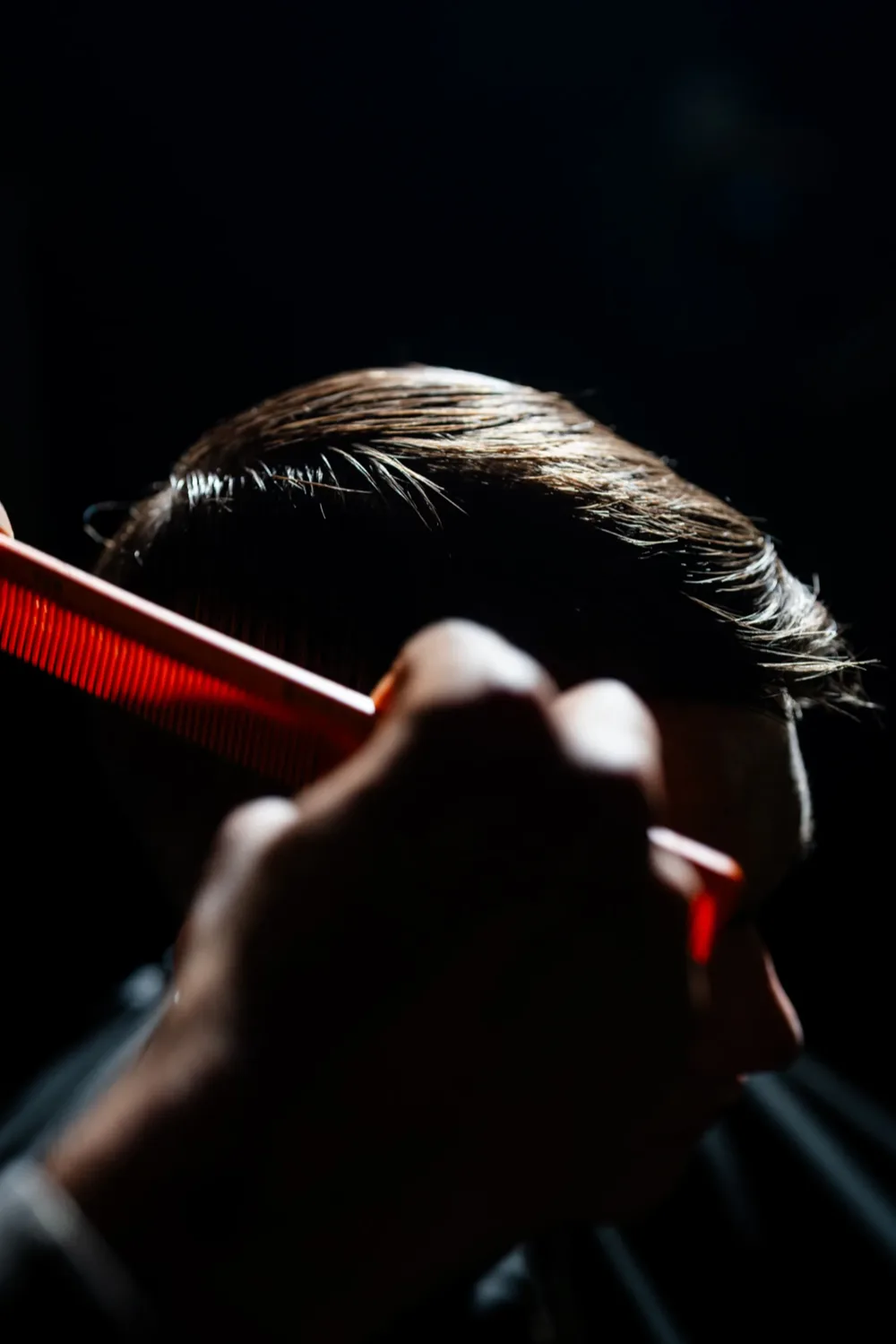 Backlit comb styling during a grooming session at Gallantier