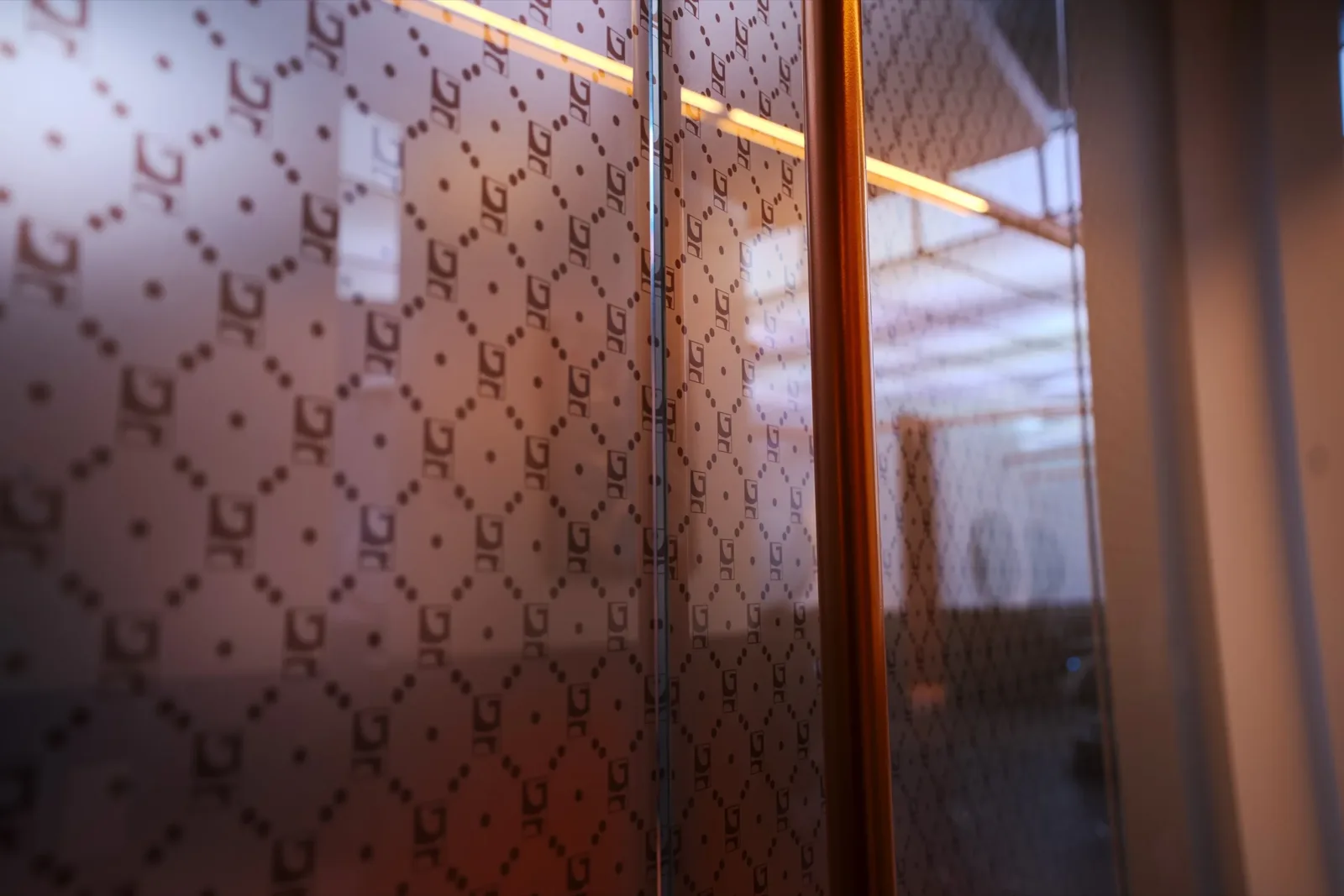 The Gallantier monogram etched into frosted glass