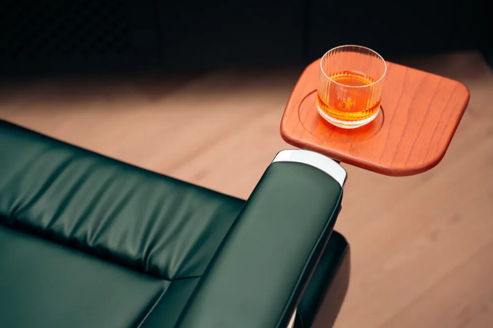 The Takara Belmont chair with its whisky tray