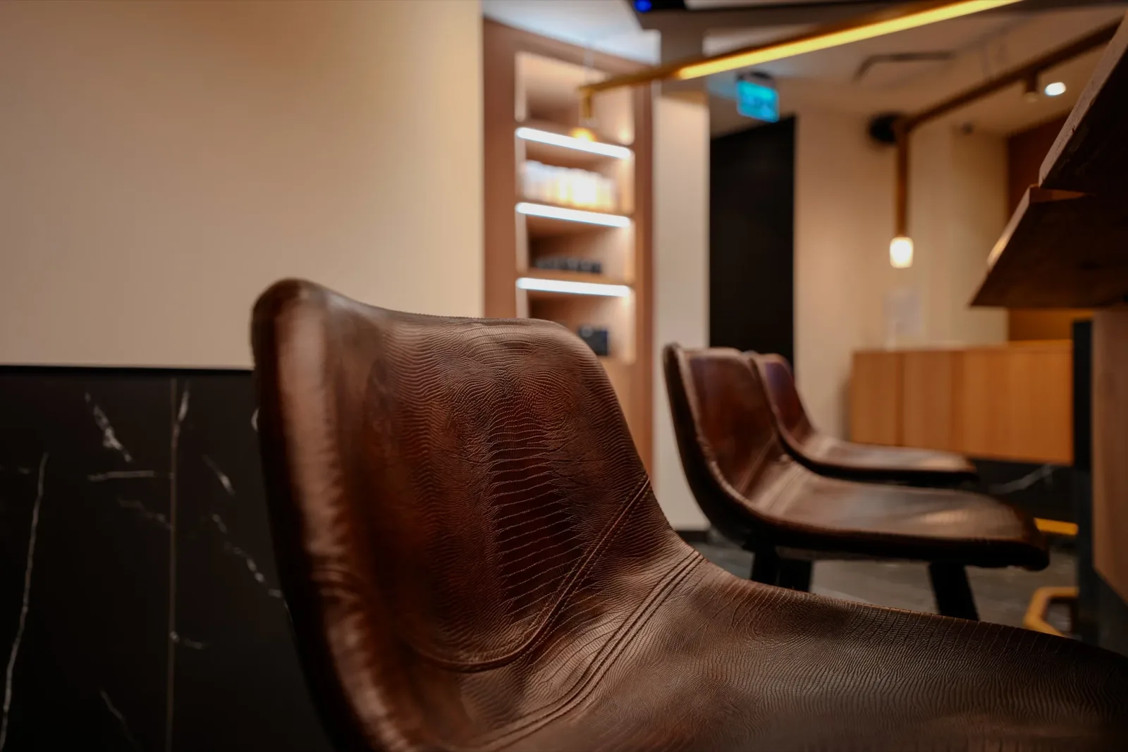 Leather stools along the member bar