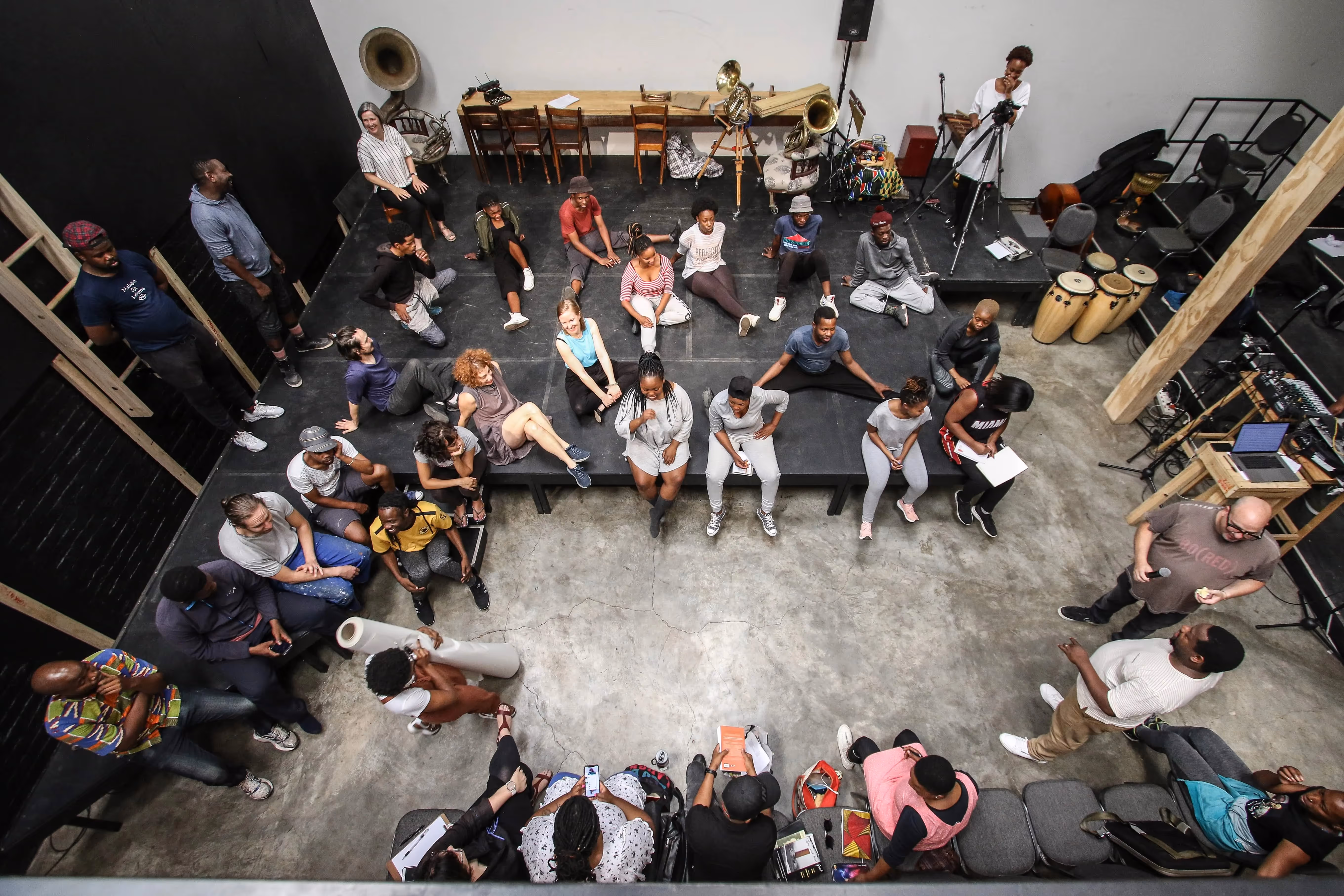 Festival di Spoleto performers gather in rehearsal space, diverse group preparing