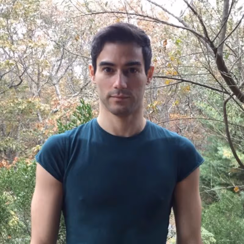 Portrait for Festival dei Due Mondi with person in teal shirt outdoors