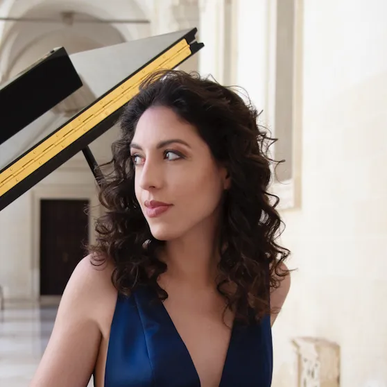 Portrait for Festival dei Due Mondi featuring elegant woman with curly hair