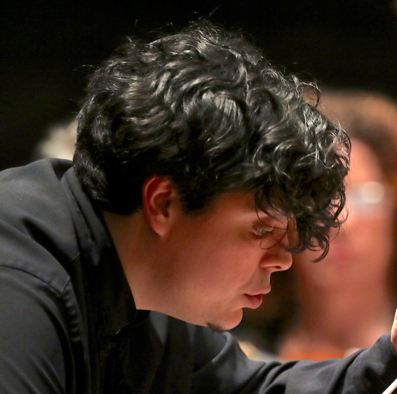 Portrait for Festival dei Due Mondi featuring curly-haired musician in concentration