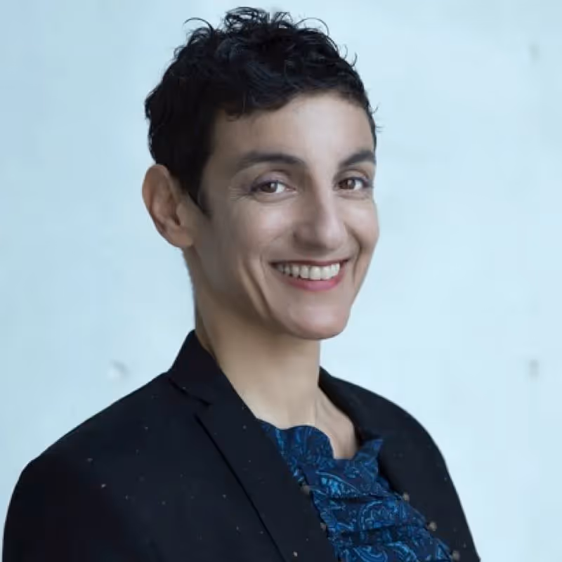 Portrait for Festival dei Due Mondi with smiling professional in black jacket