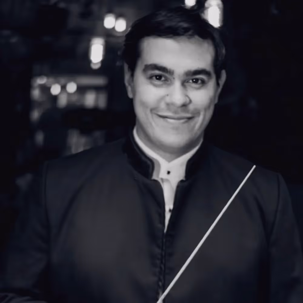 Portrait for Festival dei Due Mondi with smiling musician in black attire