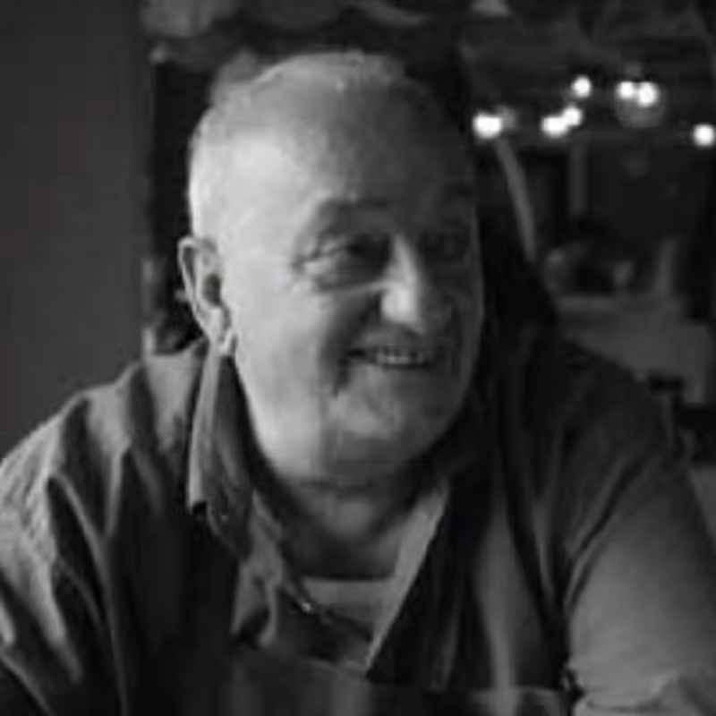 Portrait for Festival dei Due Mondi, smiling elderly man in black and white